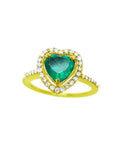 A heart cut emerald engagement ring with a halo diamonds 14k yellow gold.