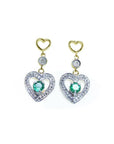 14K yellow gold heart stud earrings with dangling silver hearts, each featuring a round green emerald.