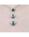 Round cut natural emeralds journey necklace heart pendant.