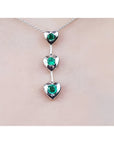 Round cut natural emeralds journey necklace heart pendant.