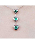 Round cut natural emeralds journey necklace heart pendant.