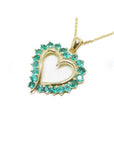 14K gold heart pendant necklace with vibrant round Colombian emeralds.