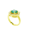 14K yellow gold horseshoe ring with cushion-cut emerald and semicircular diamond halo.