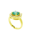 14K yellow gold horseshoe ring with cushion-cut emerald and semicircular diamond halo.