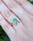A close up of a 1.48 ct. horseshoe emerald ring for women crafted in 14k yellow gold on a woman's hand