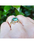 1.48 ct. cushion-cut Colombian emerald ring in 14K yellow gold with diamond horseshoe.