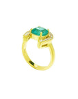 14K yellow gold horseshoe ring with a cushion-cut emerald and diamond accents.