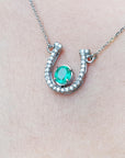 Genuine emerald horseshoe necklace with natural diamonds, crafted in 14k white gold, a lucky piece of jewelry to wear every day