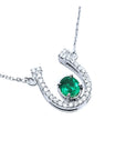 Genuine emerald horseshoe necklace with natural diamonds, crafted in 14k white gold, a lucky piece of jewelry to wear every day