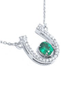 Horseshoe emerald necklace for women crafted in 14k white gold, a lucky piece of jewelry to wear every day