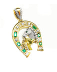 A yellow gold horseshoe pendant for men with two horse's heads, natural emeralds and diamonds right profile.