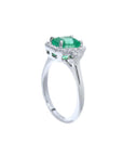 1.47 ct emerald engagement ring with diamond halo in 14K white gold.