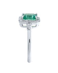 The side view of this emerald engagement ring reveals the top setting and the band design.