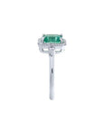 1.47 ct emerald cut emerald engagement ring with diamond halo in 14K white gold.