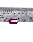 Rectangular natural ruby Burma emerald-cut table and crown visibles on a ruler for scale measurement