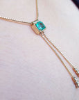 Colombian Lariat emerald necklaces for sale made in 14k yellow gold emerald-cut sourced from the Muzo mines in Colombia