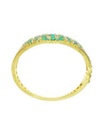 14K yellow gold bangle bracelet with round cut Colombian emeralds and diamonds in a floral design.