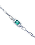14K white gold paper clip bracelet with a square bluish-green emerald and diamond halo.