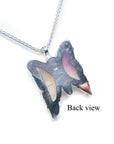 Back view of a lavender agate butterfly pendant in sterling silver on a chain.