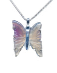 Lavender agate butterfly pendant with carved wings and sterling silver setting on a chain.