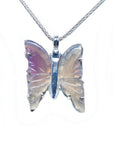 Lavender agate butterfly pendant with carved wings and sterling silver setting on a chain.
