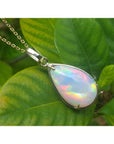 9.29 ct. pear-shaped Ethiopian opal pendant in 14K solid yellow gold, displaying a full spectrum of colors.
