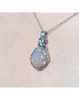 5.96 ct. Welo Ethiopian multicolor opal pendant with silver wire wrap on a silver chain.