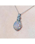 5.96 ct. Welo Ethiopian multicolor opal pendant with silver wire wrap on a silver chain.