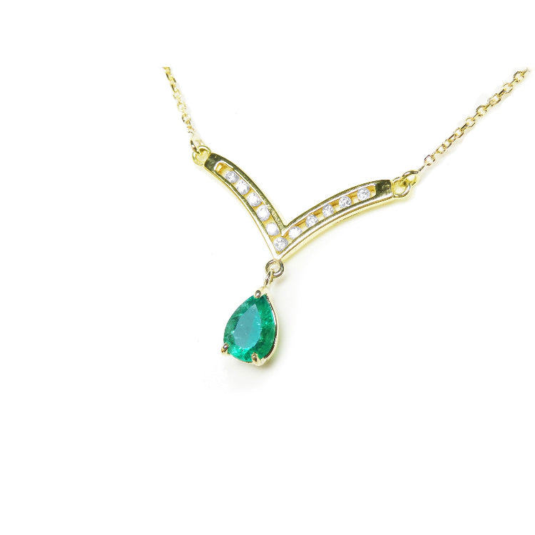 14k yellow gold pear cut emerald necklace Muzo Colombian gem is dangling from a channel set diamonds chevron design