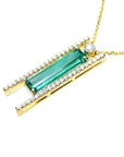 14K yellow gold necklace with a baguette-cut emerald, surrounded by natural diamonds, on a delicate chain.