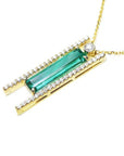 14K yellow gold necklace with a baguette-cut emerald, surrounded by natural diamonds, on a delicate chain.
