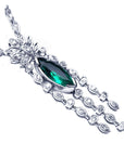 Elegant 14k white gold emerald marquise necklace on white background
