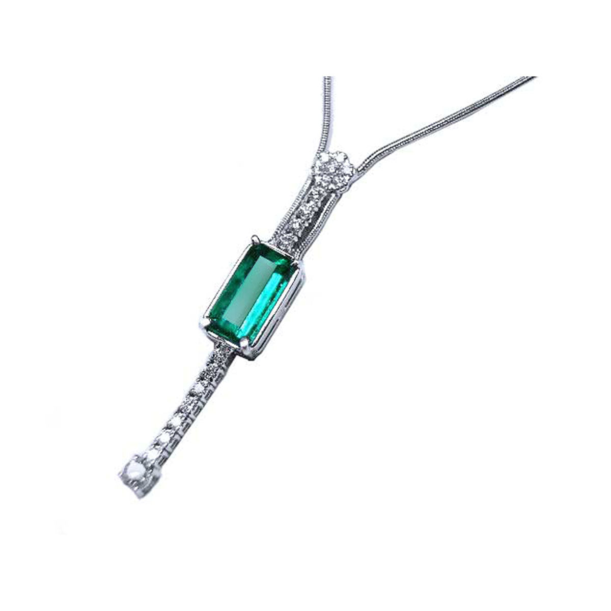 left side view of a white gold emerald necklace elongated emerald-cut natural Muzo mines in a white background