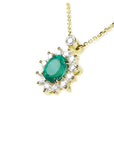 14K yellow gold necklace with oval emerald (1.11 ct) and natural diamond halo pendant.