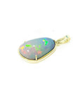 Teardrop Ethiopian opal pendant with rainbow flashes, set in 14K yellow gold.