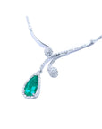 Pear cut 2.26ct natural emerald necklace in 18K white gold with diamond halo and accents.