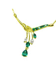 A left view of a yellow gold natural emerald and diamond necklace blended pear shaped marquises and round cuts
