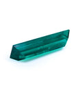 3.13 carat baguette cut Colombian emerald, eye-clean, sparkling bluish-green.