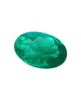 2.11 carat oval cut loose Colombian emerald, sparkling deep bluish-green.