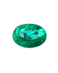 Natural loose Colombian emerald oval cut, medium-deep vibrant bluish green, very good brightness.