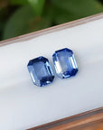 2.16 ct. loose matching pair of sparkling emerald-cut blue sapphires.