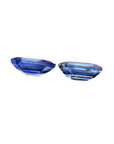 2.16 ct. Loose matching pair blue sapphires emerald-cut, underside view girdles and pavilions visibles