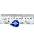 3.30 ct. Pear shaped loose blue sapphire natural gemstone, on a ruler for scale measurement