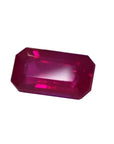 0.94 carat natural Burma ruby, emerald cut, deep red with brilliant facets.