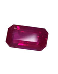 0.94 carat natural Burma ruby, emerald cut, deep red with brilliant facets.