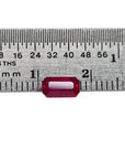 loose natural ruby emerald cut from Burma, on a ruler for scale