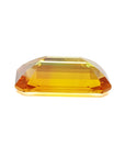4.05 ct. vibrant intense yellow sapphire, rectangular emerald-cut loose gemstone.
