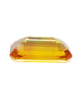 4.05 ct. vibrant intense yellow sapphire, rectangular emerald-cut loose gemstone.