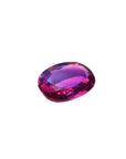 Loose natural pink sapphire oval cut from Sri Lanka, right side position displaying table and crown