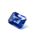 3.90 ct untreated GIA certified rectangular emerald-cut blue sapphire changing to purple.